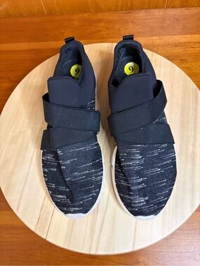 Merrell Women's Flora Day Loop slip-on sneakers in black and white.